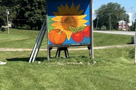 Photo of Sunflower painting in a yard